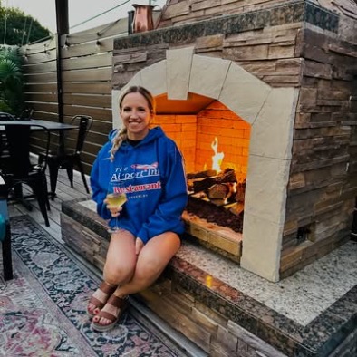 Melissa at the fireplace