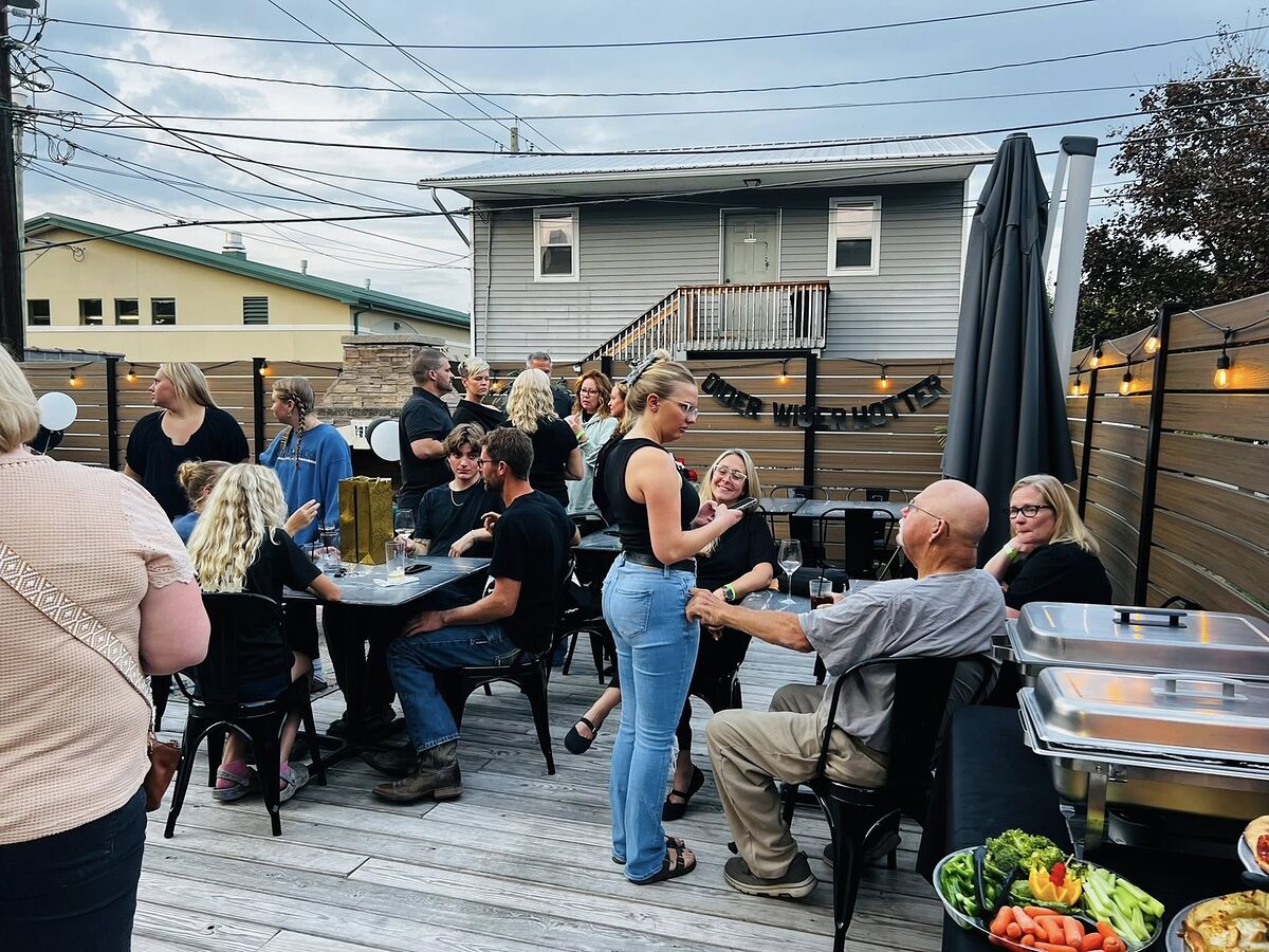 Crowded patio event at The Airport Inn Greene